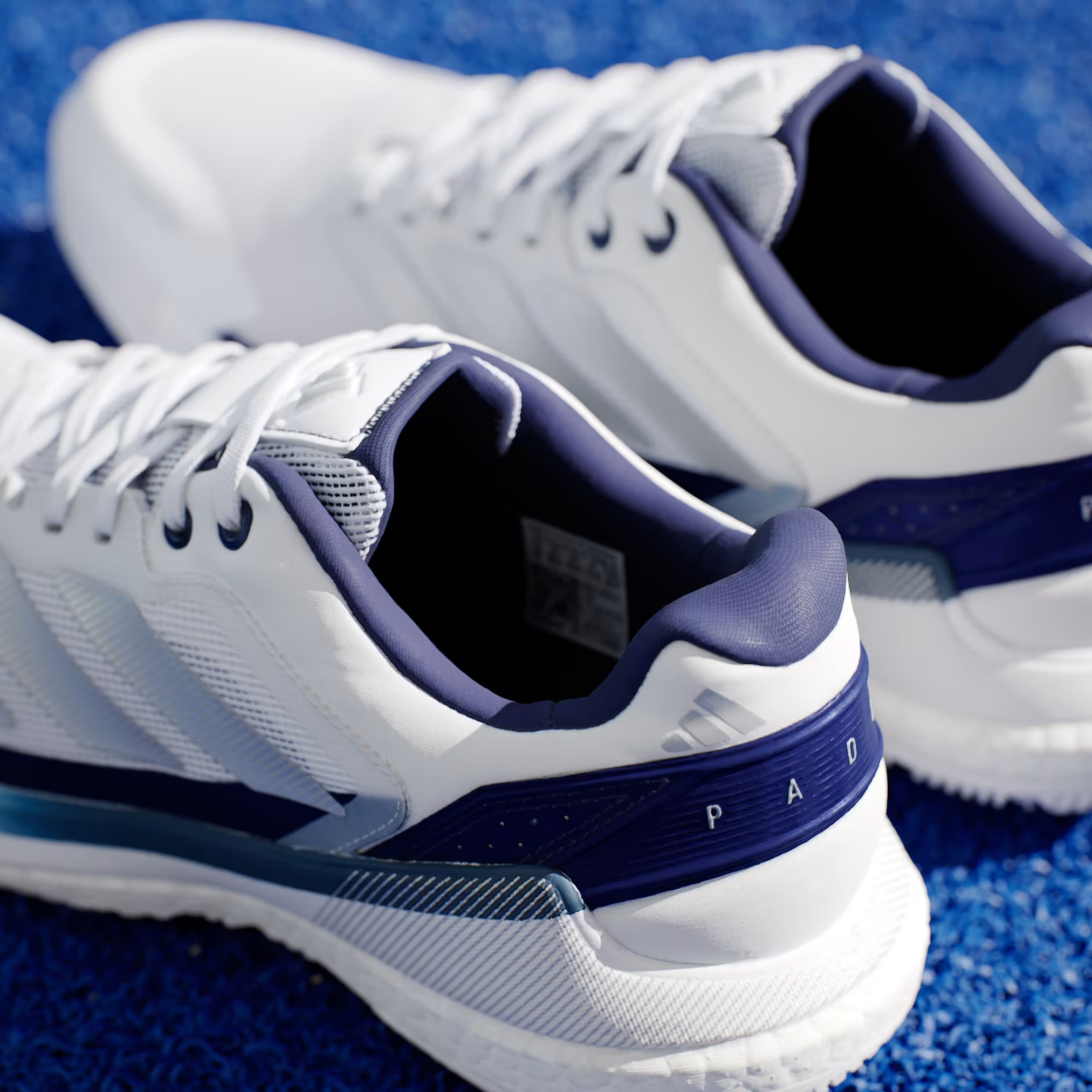 Adidas Crazyquick Boost padel shoe, white BOOST midsole and dark blue heel detail